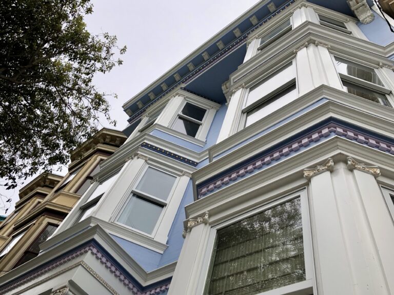 Detailed entablature with dentils and restored cornice on a classical revival facade in SF.