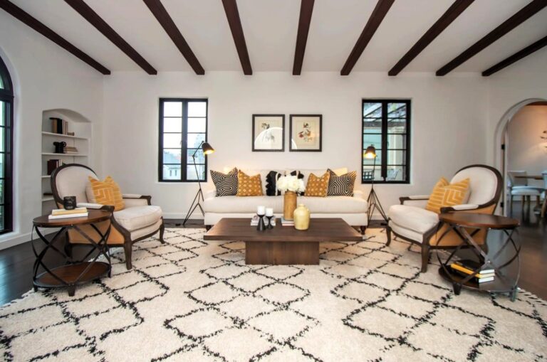 Cozy living room with wood beam ceilings and stylish furniture.