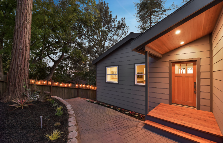 Modern house remodel with a gable roof and front porch in San Francisco Bay Area.