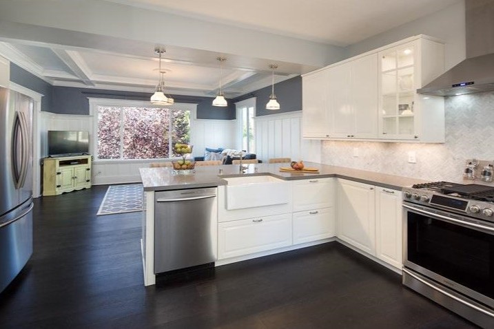 Open kitchen with peninsula, pendant lights, and modern appliances in SF